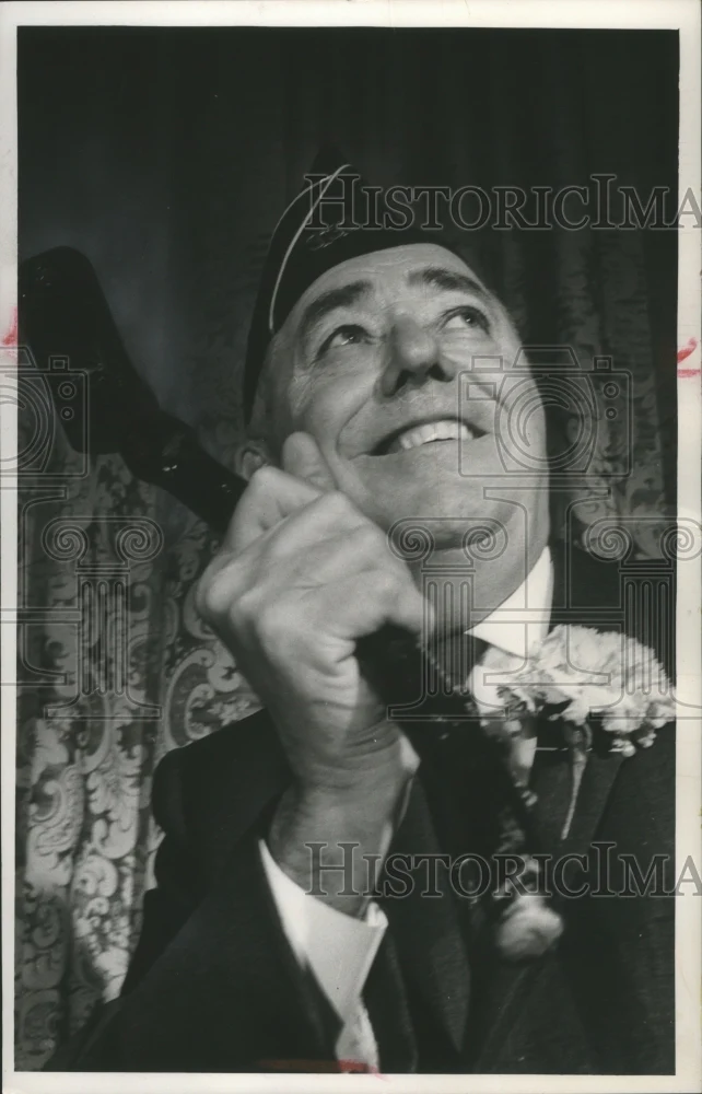 1964 Press Photo District Attorney William J. McCauley, holds a shillelagh.