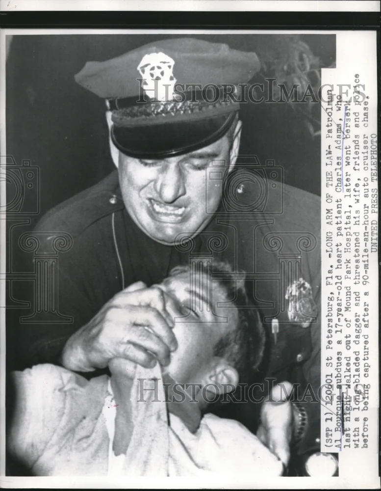 1956 Press Photo St Petersburg, Fla Patrolman Al Bourque subdues heart patient