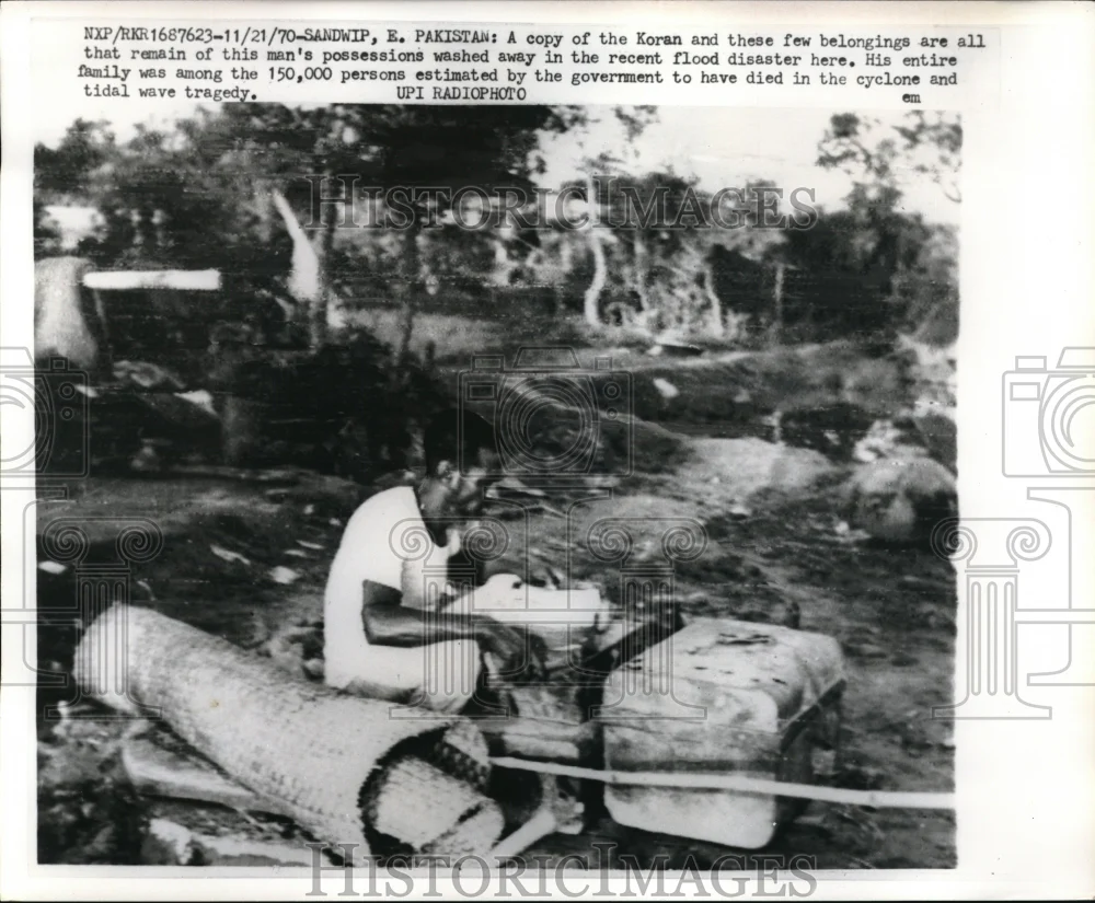 1970 Press A Copy of the Koran & few belongings are all that's left after flood