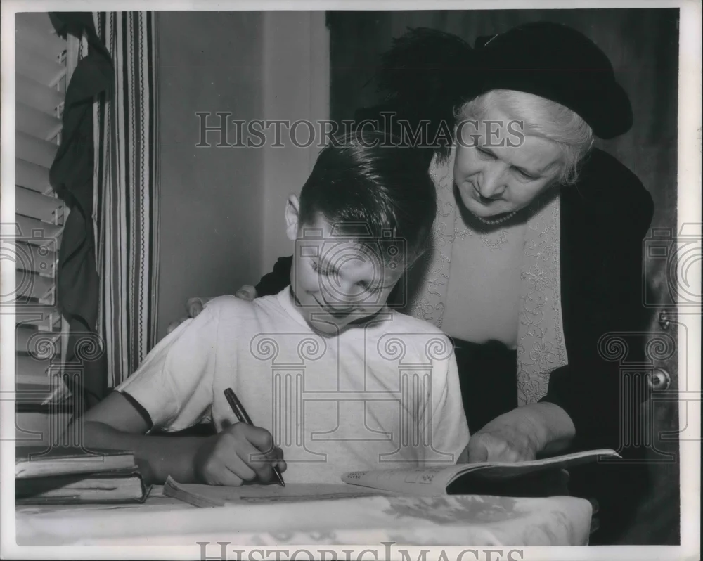 1950 Press Photo Mrs. E.J. Grant helping adopted son