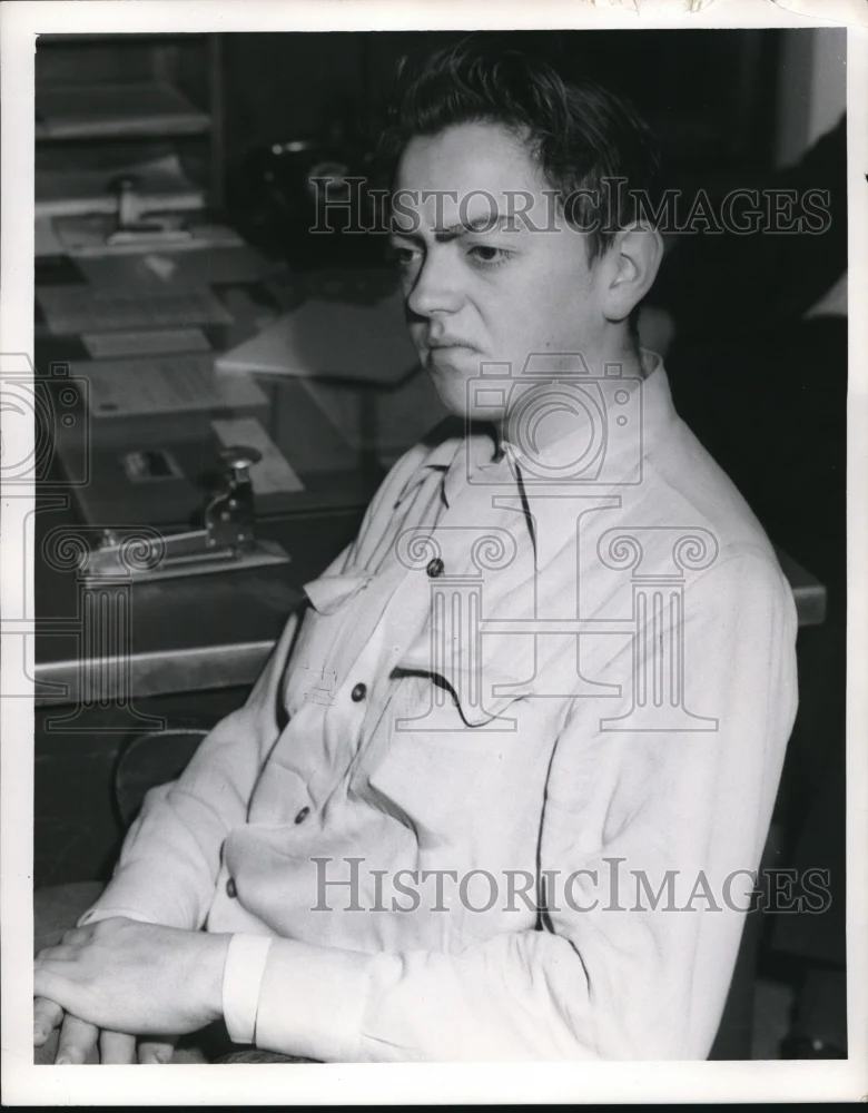 1953 Press Photo Peter K Abor being booked in Cleveland Ohio