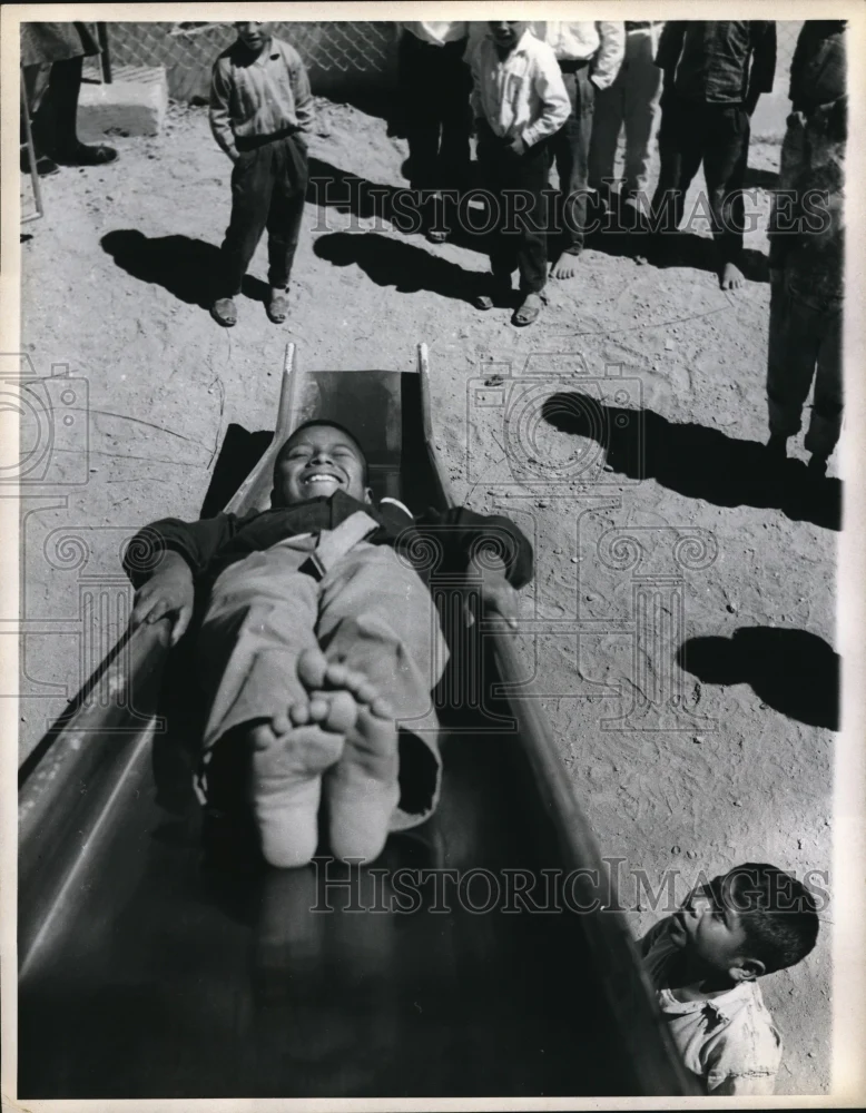 1971 Press Photo Patzun boy sliding down slide