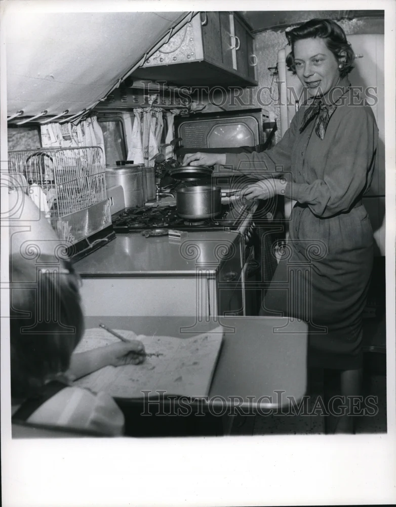 1960 Media Photo Mrs. Waggoner cooks as bus rolls with her daughter Connie
