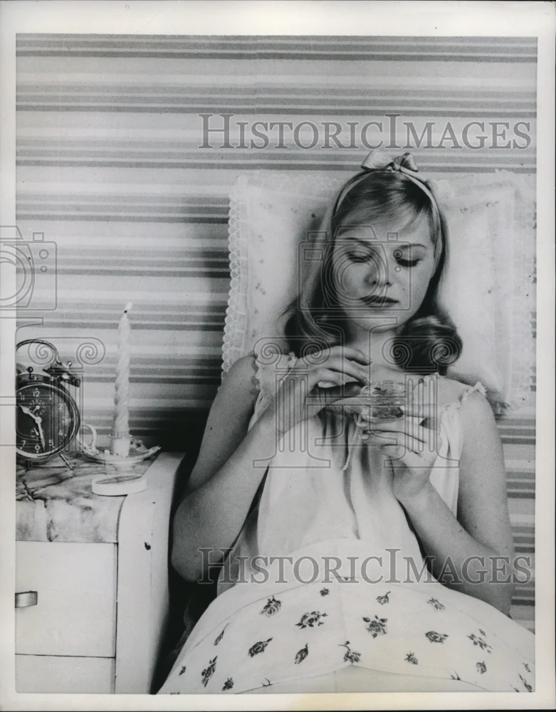 1959 Press Photo A teen ager with skin trouble & acne medicine