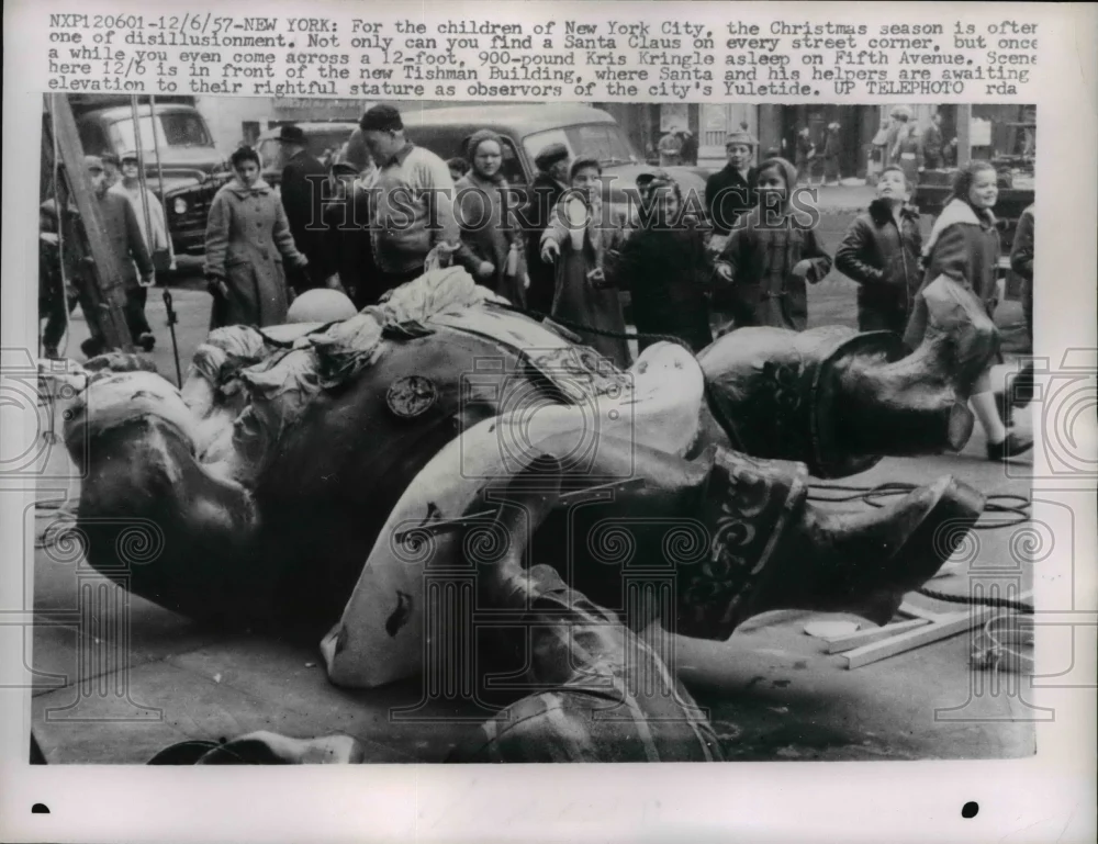 1957 Press Photo Santa Claus Statue Lays on Sidewalk, New York - nee36671