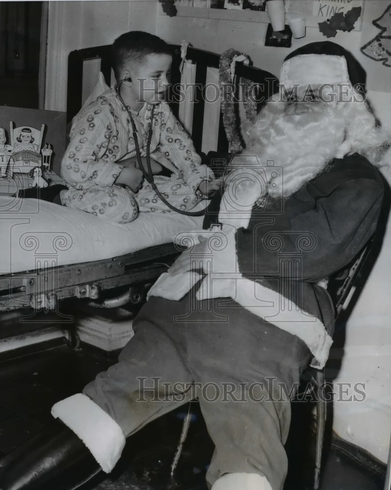 1956 Press Photo Dr. Andrew F. Lorinez gets checked by Richard Kelly - nee37019