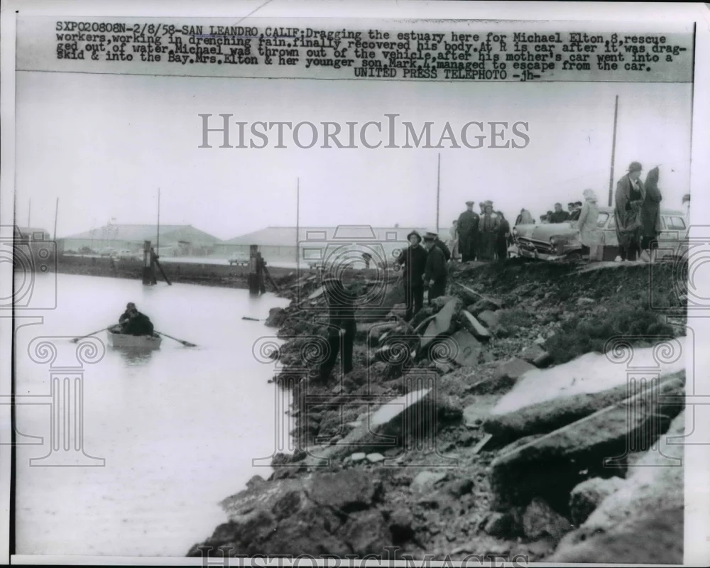 1958 Press Photo Michael Elton 8, rescued in drenching rain in Calif. Bay.