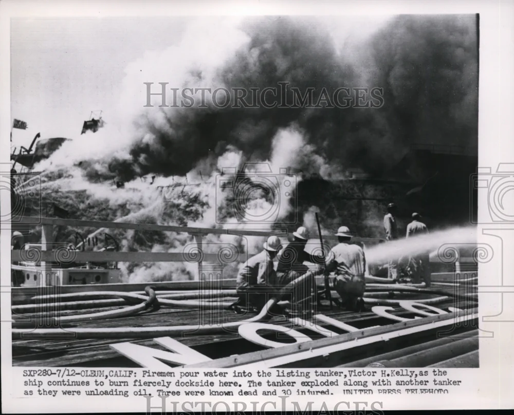 1952 Press Photo Firemen Pour Water Into The Burning Tanker - nee86523