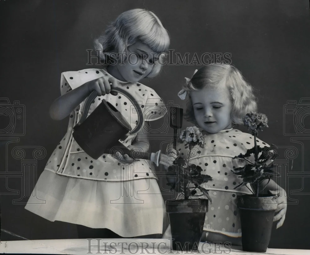 1955 Press Photo Plastics cover up bids for small fry dresses - nef04473
