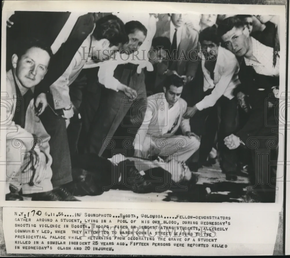 1954 Press Photo Demonstrators Gather Around Student Lying in Pool of His Blood