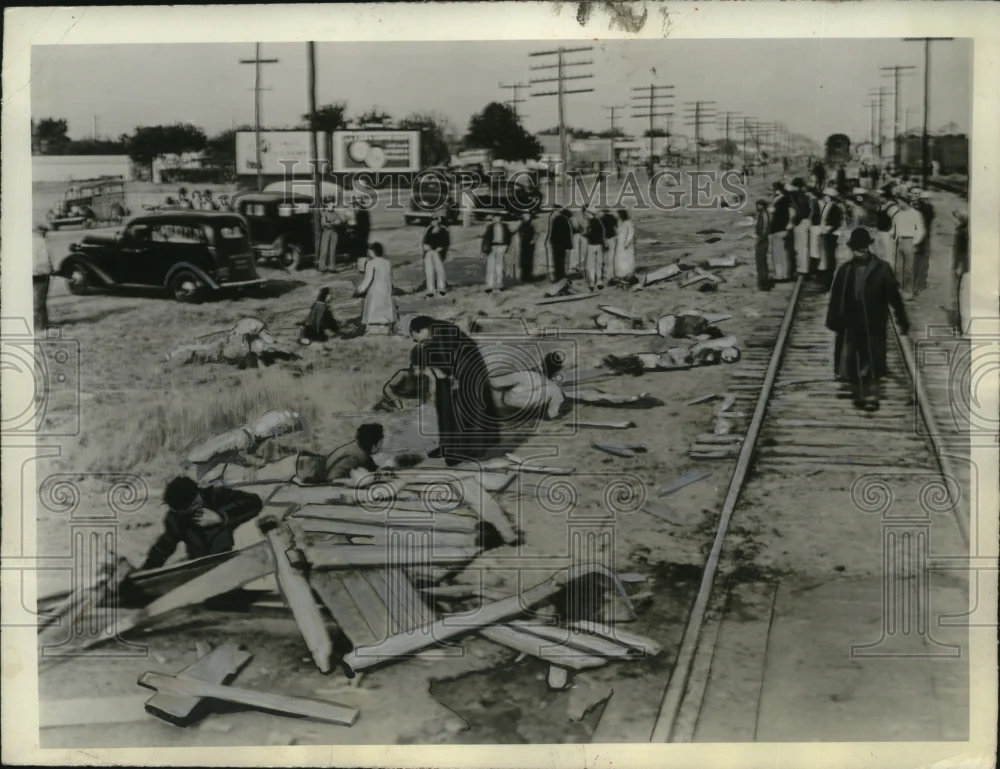 1940 Press Photo Priest Administers Last Rites to Dying Person Amid Train Wreck