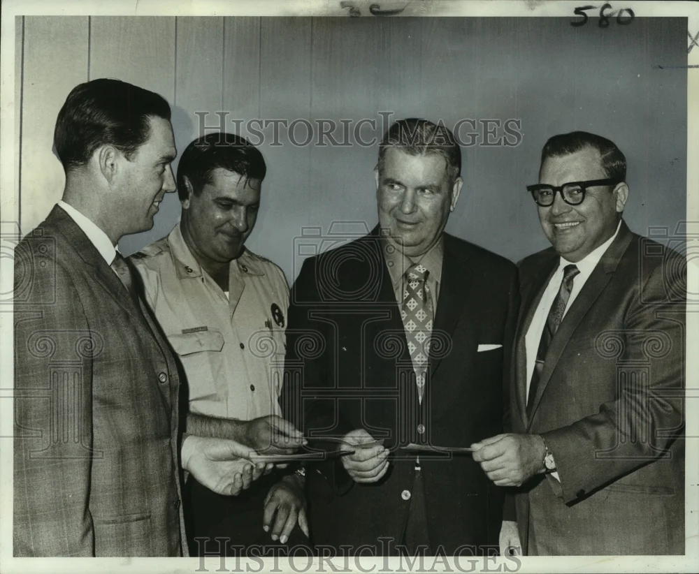 1969 Press Photo Police leaders present checks to Children Football Fund members