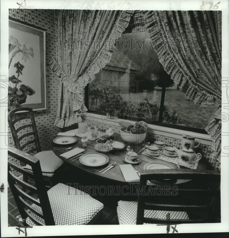 1971 Press Photo Breakfast area with checked padded chairs and flower painting