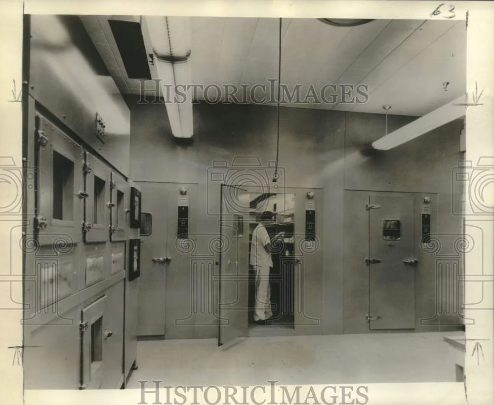 1958 Press Photo Researcher Checks Compound Stored In Drug Stability Cold Room