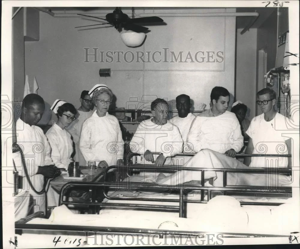1968 Press Photo Oil rig disaster victim surrounded by Health Service team