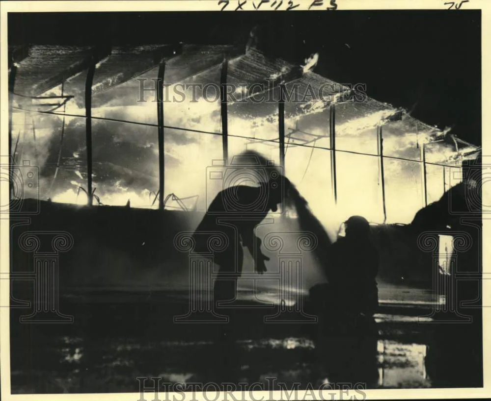 1976 Press Photo Firemen Pump Water into the Slidell High School gymnasium