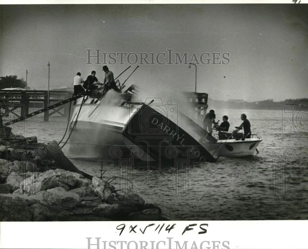 1978 Press Photo Firemen Clamber Aboard Burning Darryl Too at Breakwater Drive