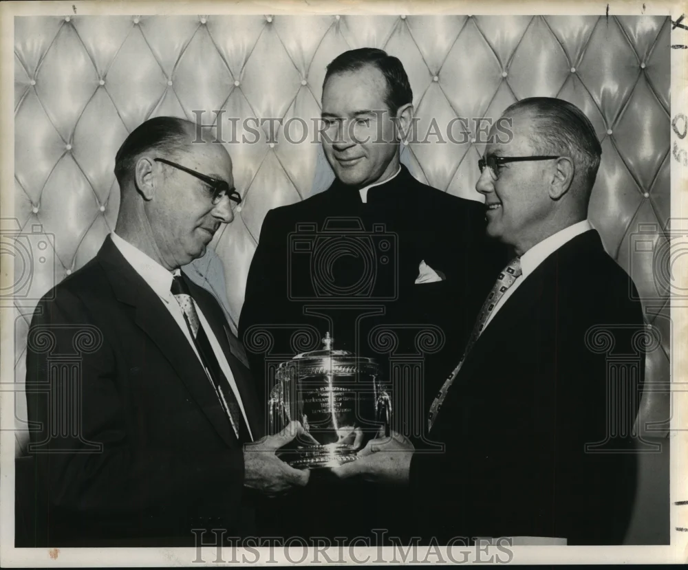 1955 Press Photo Dr. A.C. Broussard receives silver award Loyola Dental Alumni