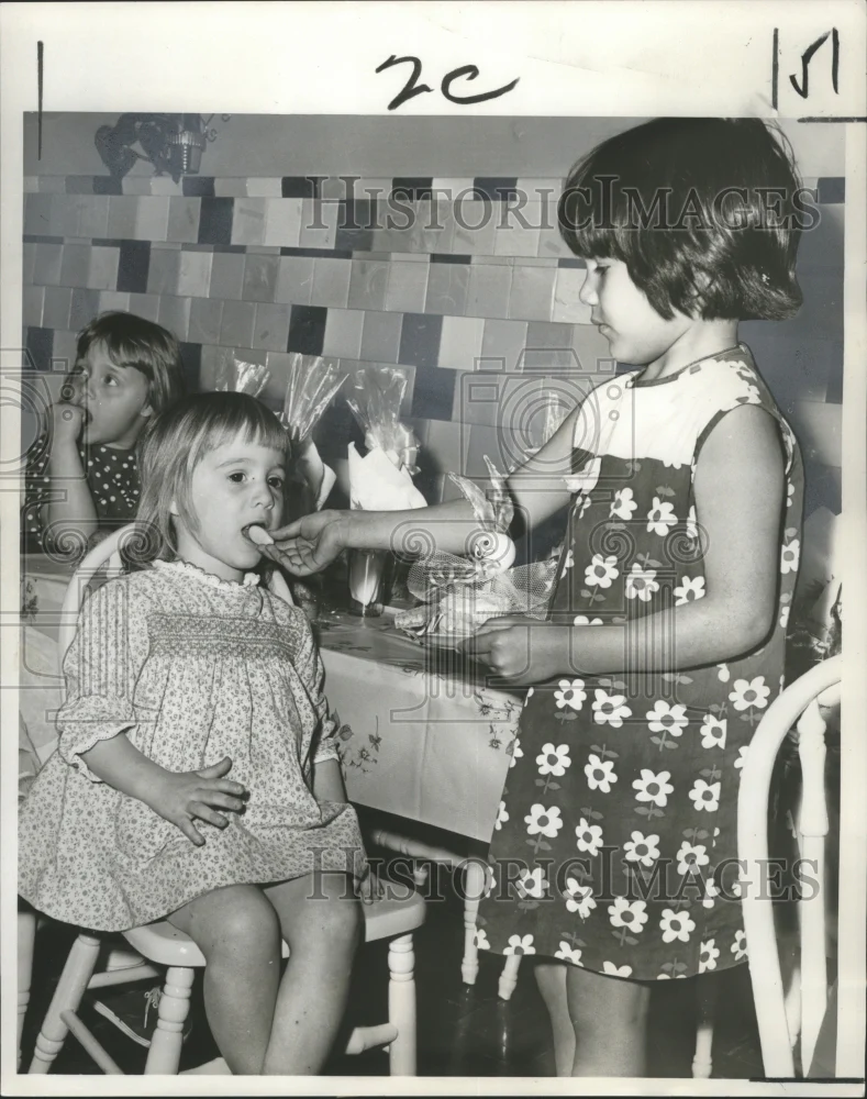 1966 Press Photo Children try eggs at the Easter Egg Hunt at Carbini Day Nursery