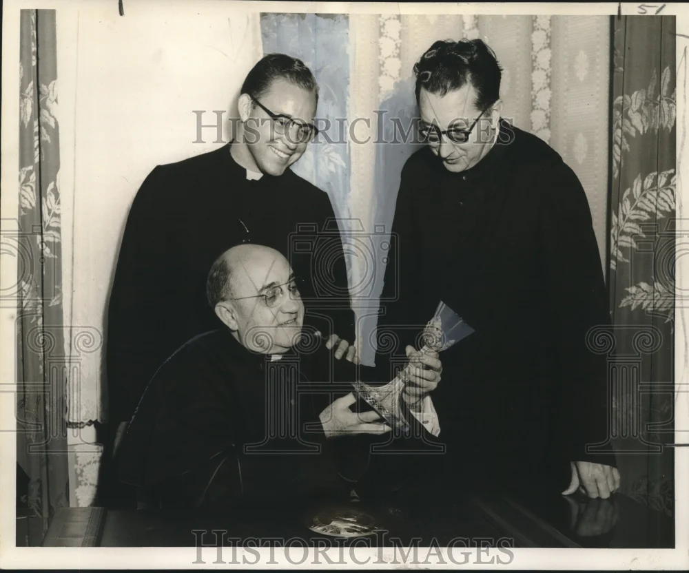 1957 Press Photo St. Rose of Lima Church priests examine parishioner heirlooms