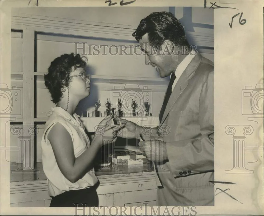 1956 Press Photo Susan Buillard receives trophy for most improved girl swimmer