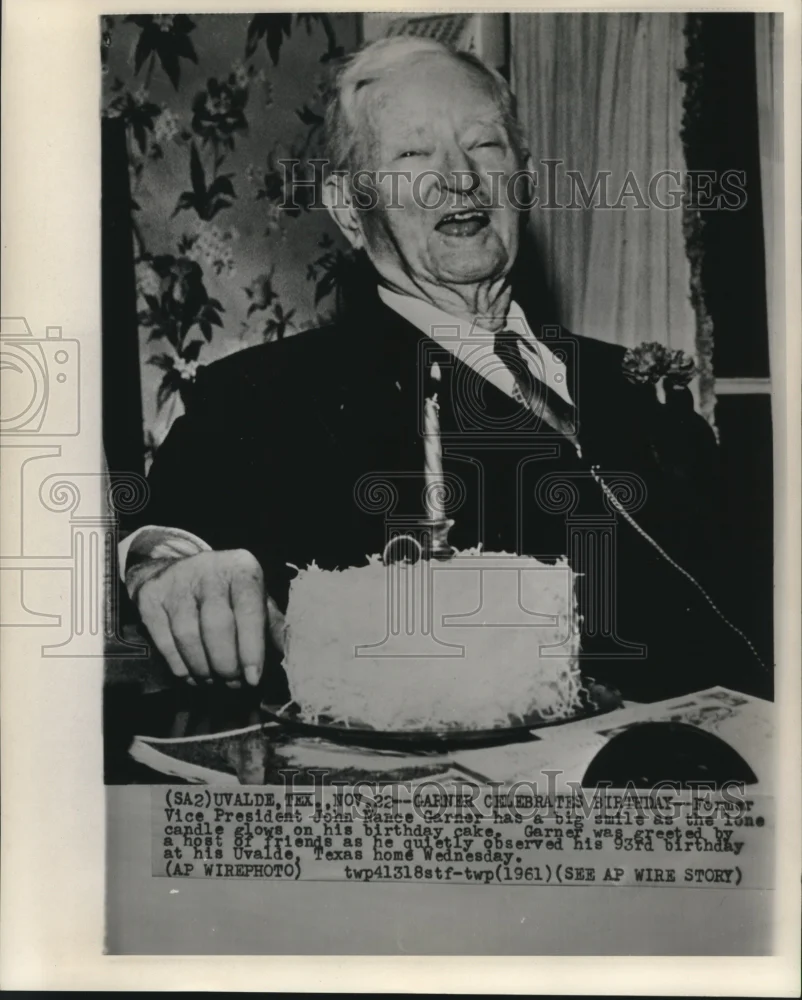 1961 Press Photo Former Vice-President Garner laughs at cake candle on birthday