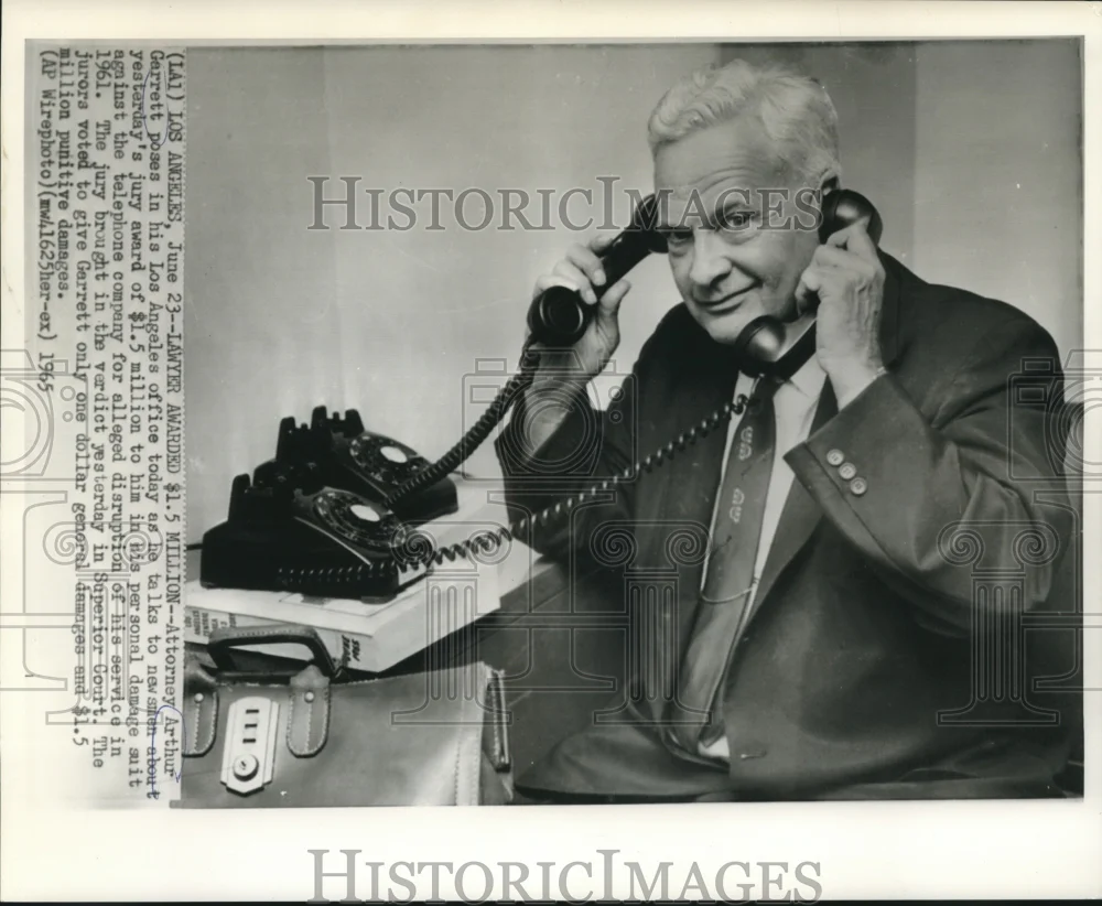 1965 Press Photo Attorney Arthur Garrett on pone with newsmen in Los Angeles