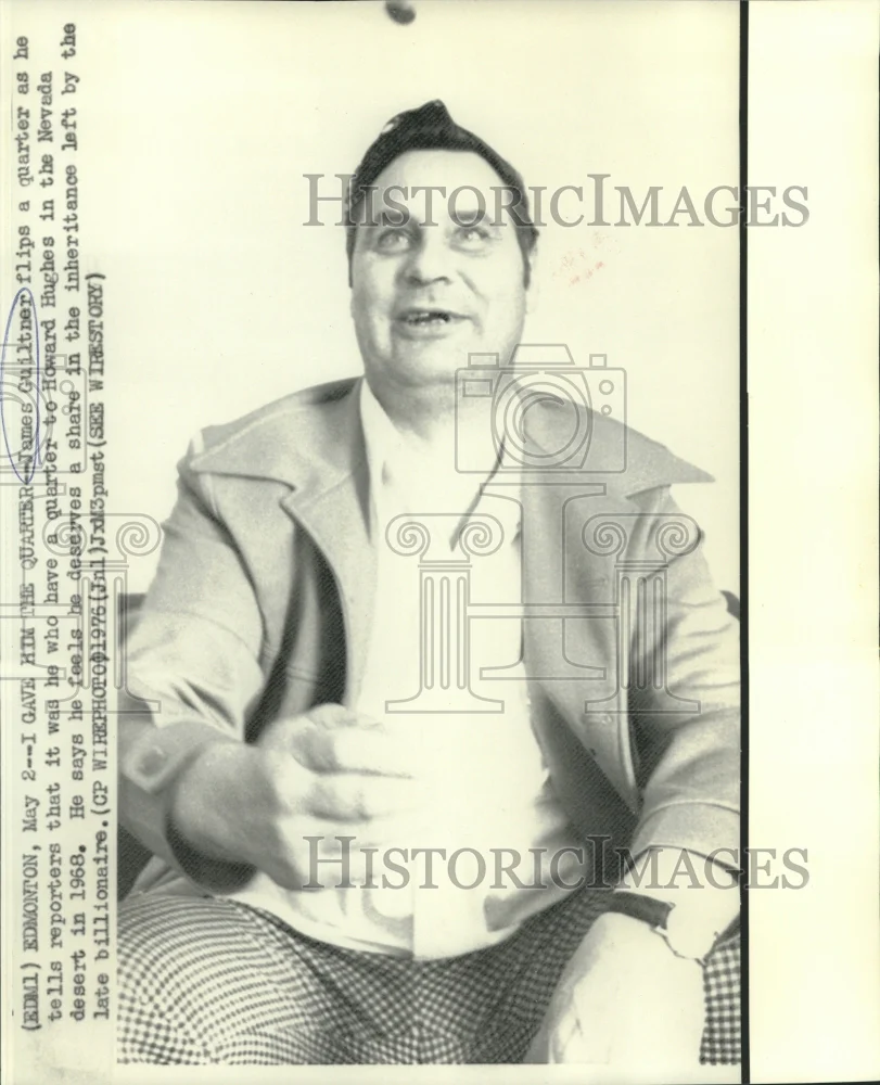 1976 Press Photo James Guiltner flips a quarter as he talks to newsmen