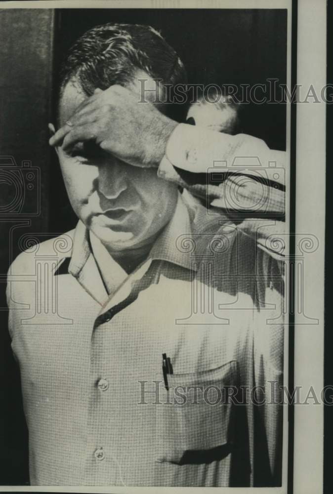 1967 Press Photo Bouvier Hinkle peeps under cupped hand threatens photographer