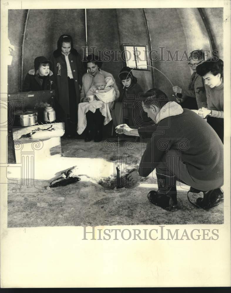 1967 Press Photo Ice fishing from inside igloo. - now10547