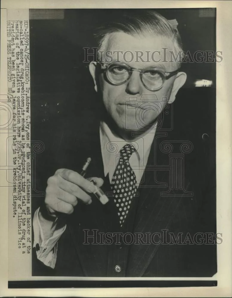1953 Press Photo Dr. Andrew Ivy holds vial of cancer drug krebiozen at hearing.