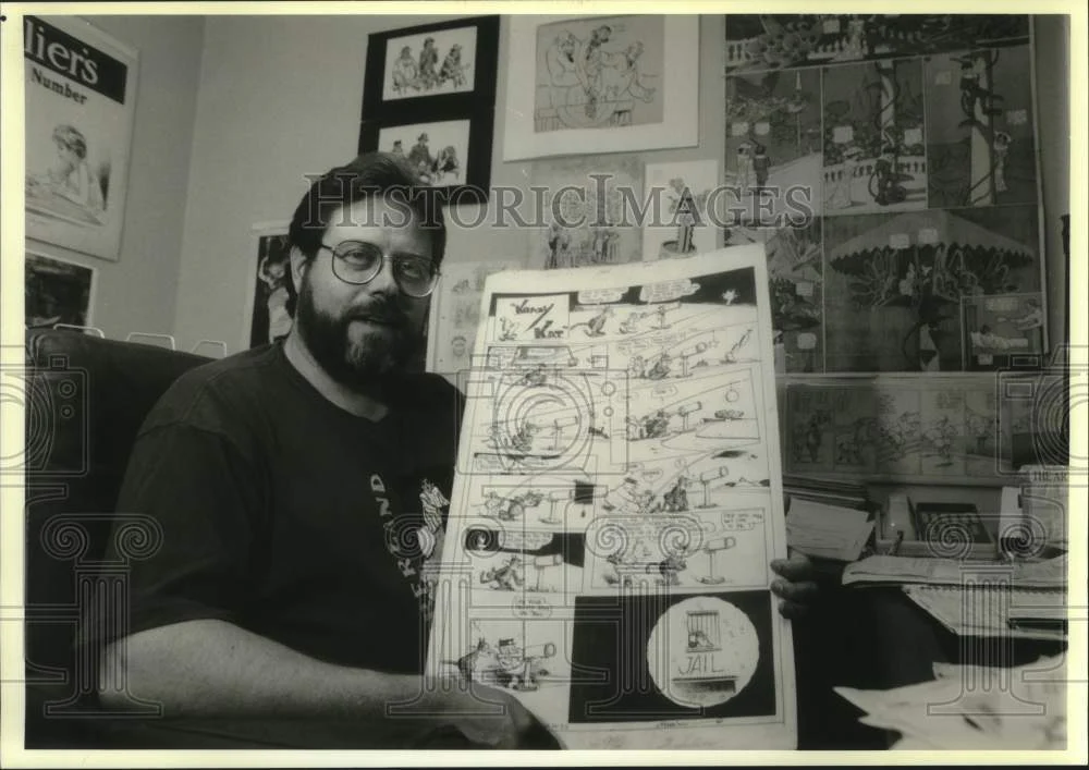 1993 Press Photo Cartoon historian and critic Rick Marschall, holds cartoon