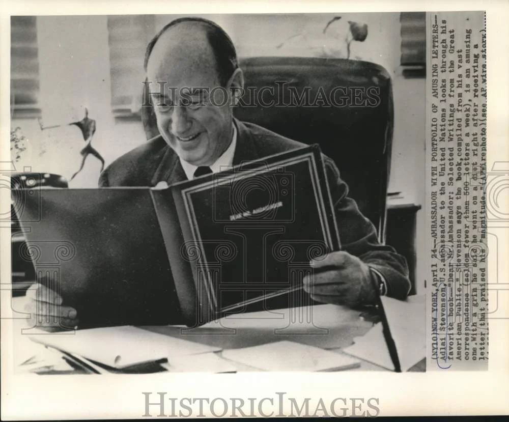 1964 Press Photo Adlai Stevenson looks through his book of amusing letters