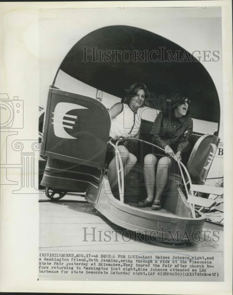 1964 Press Photo Luci Johnson and Beth Jenkins enjoy Wisconsin State Fair ride