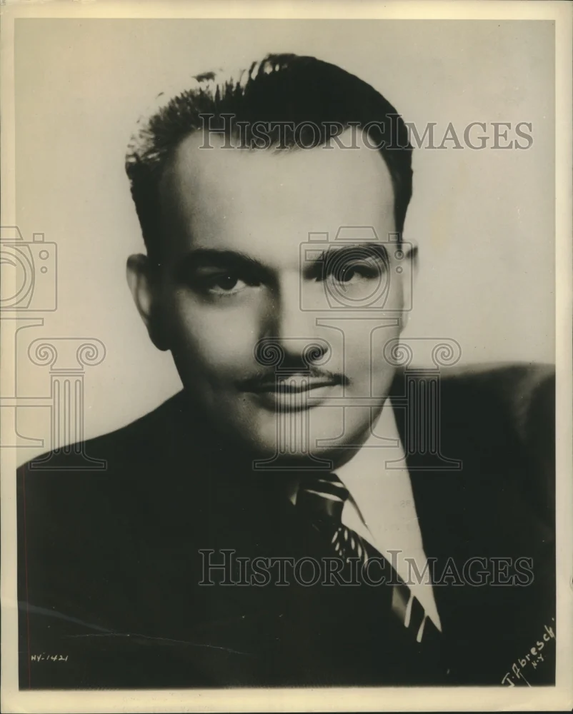 1943 Press Photo Tenor Donald Dame signed to a contract by Metropolitan Opera