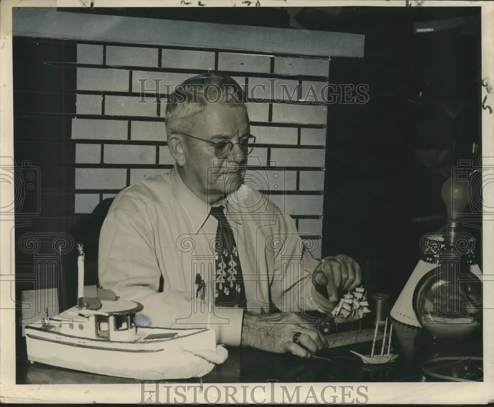 1950 Press Photo Lieutenant Commander James J. Graham builds model boat